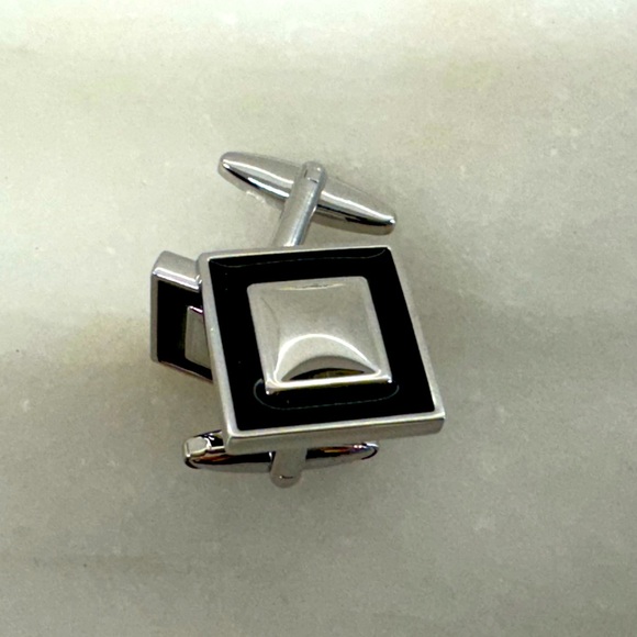 Silver and black enamel cufflinks.